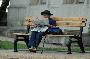 cute old lady sitting on the bench at the art muesem in bucharest