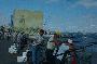 men fishing on the galata bridge in istanbul