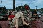 tina and alex relaxing on top of the boat in halong bay